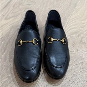 Pre loved authentic Black Leather Loafers with Gold Detail